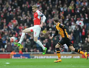 Arsenal V Hull City - FA Cup 2015-16 Prints: Per Mertesacker vs Nick Powell: A FA Cup Battle at Arsenal's Emirates Stadium