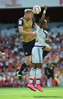 Arsenal V Olympique Lyonnais - Emirates Cup 2015/16 Prints: Mertesacker vs. N'Jie: A Tense Face-Off at Arsenal's Emirates Cup