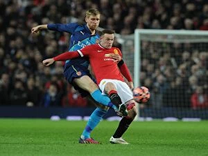 Images Dated 13th February 2009: Mertesacker vs. Rooney: FA Cup Quarterfinal Showdown - Manchester United vs. Arsenal, 2015