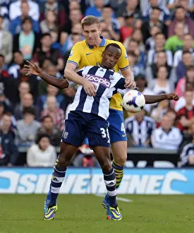 West Bromwich Albion V Arsenal 2013-14 Prints: Per Mertesacker vs. Saido Berahino: A Battle in the Premier League (West Bromwich Albion vs)