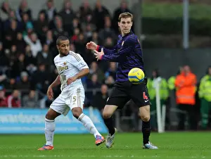 Per Mertesacker vs Wayne Routledge: Intense Battle in Swansea City vs Arsenal FA Cup Clash