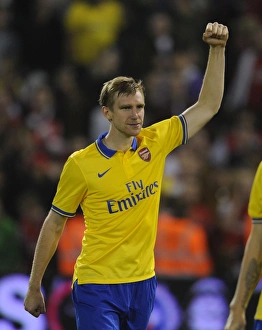 West Bromwich Albion V Arsenal 2013-14 - Capital Cup Prints: Per Mertesacker's Celebration: Arsenal's Capital One Cup Victory over West Bromwich Albion