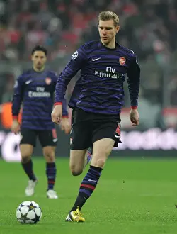 Per Mertesacker's Defiant Display: Arsenal's Valiant Stand at Allianz Arena, UEFA Champions League 2012-13