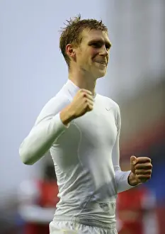 Wigan Athletic V Arsenal 2012-13 Prints: Per Mertesacker's Euphoric Moment: Arsenal's Victory Celebration at Wigan Athletic