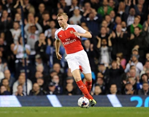 Tottenham Hotspur V Arsenal Capital One Cup 2015/16 Prints: Per Mertesacker's Intense Focus: Arsenal vs. Tottenham Capital One Cup Showdown