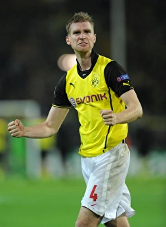 Borussia Dortmund V Arsenal 2013-14 Prints: Per Mertesacker's Triumph: Borussia Dortmund vs. Arsenal, UEFA Champions League (2013)