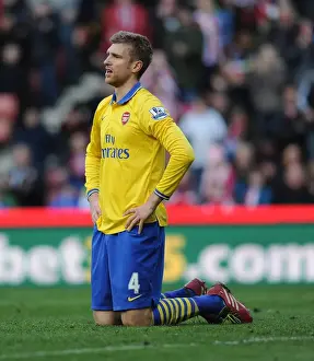 Stoke City V Arsenal 2013-14 Prints: Per Mertesacker's Unwavering Concentration: Arsenal vs Stoke City Showdown (2014)