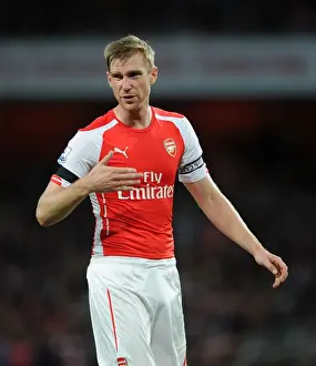 Arsenal V Burnley 2014/15 Prints: Per Mertesacker's Unwavering Focus: Arsenal's Triumph Over Burnley (2014/15)
