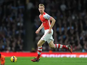 Arsenal V Burnley 2014/15 Prints: Per Mertesacker's Unwavering Focus: Arsenal's Triumph Over Burnley (2014/15)
