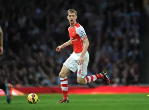 Arsenal V Burnley 2014/15 Prints: Per Mertesacker's Unwavering Focus: Arsenal's Triumph Over Burnley (2014/15)