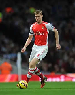 Arsenal V Burnley 2014/15 Prints: Per Mertesacker's Unwavering Focus: Arsenal's Triumph Over Burnley (2014/15)