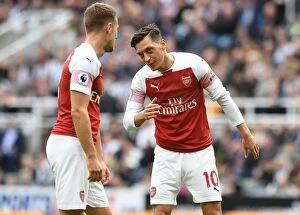 Images Dated 15th September 2018: Mesut Ozil and Aaron Ramsey in Deep Conversation: Newcastle United vs