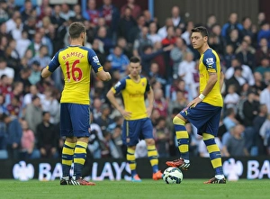 Aston Villa V Arsenal 2014-15 Prints: Mesut Ozil and Aaron Ramsey Kick Off Aston Villa vs. Arsenal Premier League Match, 2014-15