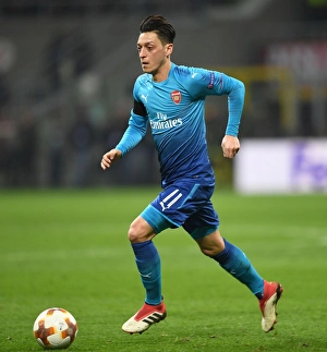 AC Milan V Arsenal 2017-18 Prints: Mesut Ozil in Action: Arsenal vs. AC Milan, UEFA Europa League Round of 16 (First Leg)