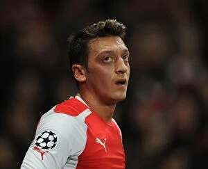 Images Dated 25th February 2015: Mesut Ozil in Action: Arsenal vs AS Monaco, UEFA Champions League 2015