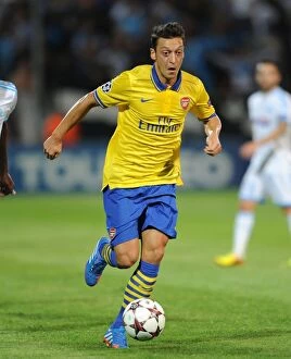 Images Dated 18th September 2013: Mesut Ozil in Action: Arsenal vs. Olympique de Marseille, UEFA Champions League (2013-14)