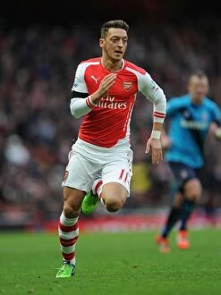 Images Dated 11th January 2015: Mesut Ozil in Action: Arsenal vs. Stoke City (Premier League 2014-15)