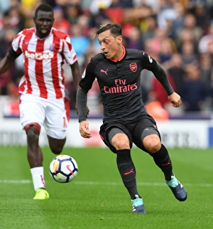 Stoke City V Arsenal 2017-18 Prints: Mesut Ozil in Action: Arsenal vs Stoke City, Premier League 2017-18