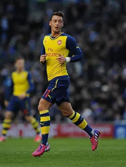 Brighton And Hove Albion V Arsenal - FA Cup 2014/15 Prints: Mesut Ozil in Action: Arsenal's FA Cup Star Performer vs