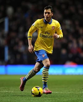 Images Dated 13th January 2014: Mesut Ozil in Action: Aston Villa vs. Arsenal, Premier League 2013-14