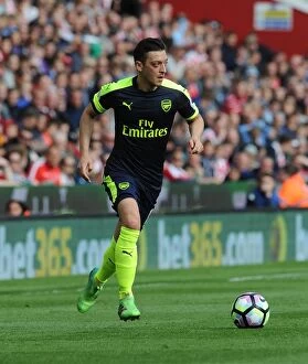 Images Dated 13th May 2017: Mesut Ozil in Action: Stoke City vs Arsenal, Premier League 2016-17