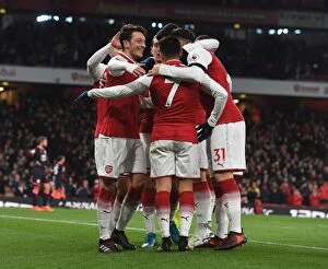 Arsenal v Huddersfield Town 2017-18 Collection: Mesut Ozil and Alexis Sanchez Celebrate Arsenal's Goals Against Huddersfield Town, 2017-18 Season
