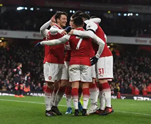 Arsenal V Huddersfield Town 2017-18 Prints: Mesut Ozil and Alexis Sanchez Celebrate Arsenal's Goals Against Huddersfield Town