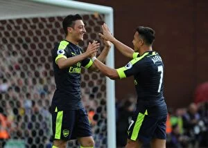 Images Dated 13th May 2017: Mesut Ozil and Alexis Sanchez Celebrate Goals: Stoke City vs Arsenal, Premier League 2016-17