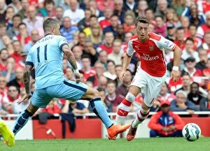 Images Dated 13th September 2014: Mesut Ozil (Arsenal) Alexander Kolarov (Man City). Arsenal 2: 2 Manchester City. Barclays