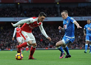 Arsenal v AFC Bournemouth 2016/17 Gallery: Mesut Ozil (Arsenal) Brad Smith (Bournemouth). Arsenal 3: 1 Bournemouth. Premier League