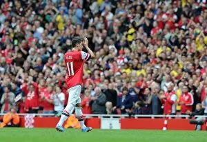 Arsenal v Stoke City 2013-14 Gallery: Mesut Ozil (Arsenal) claps the fans as he leaves the pitch. Arsenal 3: 1 Stoke City