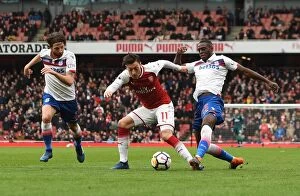 Arsenal v Stoke City 2017-18 Collection: Mesut Ozil (Arsenal) is fouled by Bruno Martins Indi (Stoke). Arsenal 3: 0 Stoke City