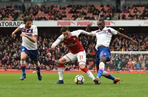 Arsenal V Stoke City 2017-18 Prints: Mesut Ozil (Arsenal) is fouled by Bruno Martins Indi (Stoke). Arsenal 3: 0 Stoke City