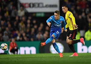 Watford v Arsenal 2017-18 Collection: Mesut Ozil (Arsenal) Jose Holebas (Watford). Watford 2: 1 Arsenal. Premier League