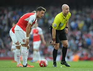 Mesut Ozil (Arsenal) and Referee Anthony Taylor