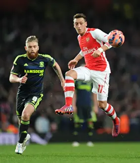 Arsenal V Middlesbrough - FA Cup 2014-15 Prints: Mesut Ozil Breaks Past Middlesbrough's Defence in FA Cup Fifth Round Clash