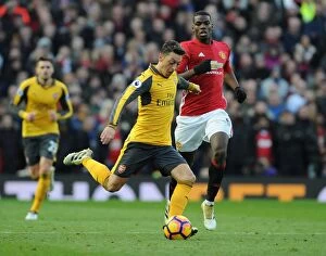 Images Dated 19th November 2016: Mesut Ozil Breaks Past Pogba: Manchester United vs. Arsenal, Premier League 2016-17