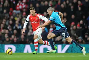 Arsenal V Stoke City 2014-15 Prints: Mesut Ozil Breaks Past Stoke's Walters in Arsenal's Premier League Clash (Arsenal v Stoke City 2014-15)