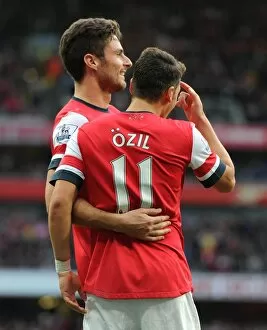 Mesut Ozil celebrates scoring his 1st goal, Arsenals 2nd, with Olivier Giroud. Arsenal 4