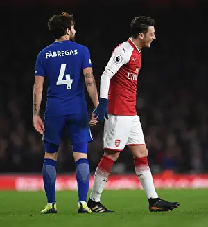 Arsenal V Chelsea 2017-18 Prints: Mesut Ozil and Cesc Fabregas Share a Light-Hearted Moment Amidst Rivalry: Arsenal vs
