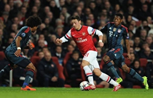 Arsenal V Bayern Munich 2013-14 Prints: Mesut Ozil Clashes with Dante and David Alaba in Arsenal vs. Bayern Munich UCL Showdown