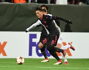Ostersunds V Arsenal 2017-18 Prints: Mesut Ozil Clashes with Dennis Widgren: Ostersunds FK vs Arsenal, UEFA Europa League