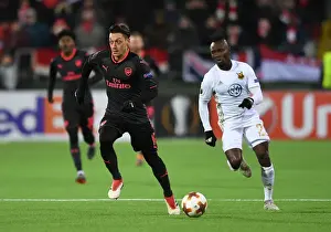 Ostersunds V Arsenal 2017-18 Prints: Mesut Ozil Clashes with Samuel Mensah: Ostersunds FK vs Arsenal, UEFA Europa League