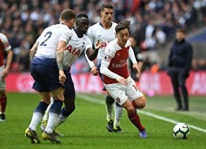 Images Dated 2nd March 2019: Mesut Ozil Clashes with Triple Threat: Tripper, Sanchez, and Lamela in Intense Tottenham-Arsenal