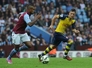 Aston Villa V Arsenal 2014-15 Prints: Mesut Ozil Closes In on Leandro Bacuna: Aston Villa vs Arsenal, Premier League 2014-15