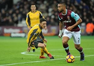 West Ham United v Arsenal 2016-17 Collection: Mesut Ozil Closes Down Winston Reid: Intense Battle Between West Ham and Arsenal (2016-17)