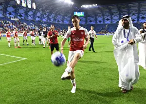 Al-Nasr Dubai SC V Arsenal 2018-19 Prints: Mesut Ozil Connects with Arsenal Fans: Post-Match Ball Sharing in Dubai, 2019