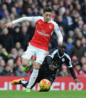 Images Dated 14th February 2016: Mesut Ozil Darts Past N'Golo Kante: Arsenal vs Leicester City, Premier League 2015-16