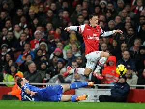 Images Dated 23rd December 2013: Mesut Ozil Evades Branislav Ivanovic: Intense Moment from the Arsenal vs Chelsea Clash (2013-14)