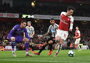 Arsenal V Newcastle United 2018-19 Prints: Mesut Ozil Faces Intense Pressure from Newcastle's DeAndre Yedlin